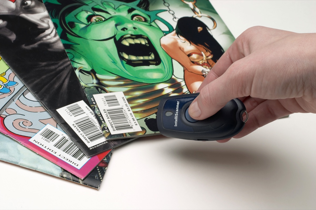 Hand scanning a comic book stack with the mini